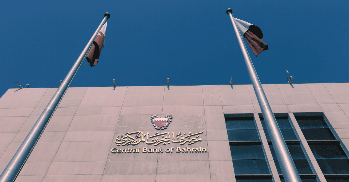 Central Bank of Bahrain building exterior with Bahraini flags — the regulatory authority issuing CBB Category 3 crypto-asset licences
